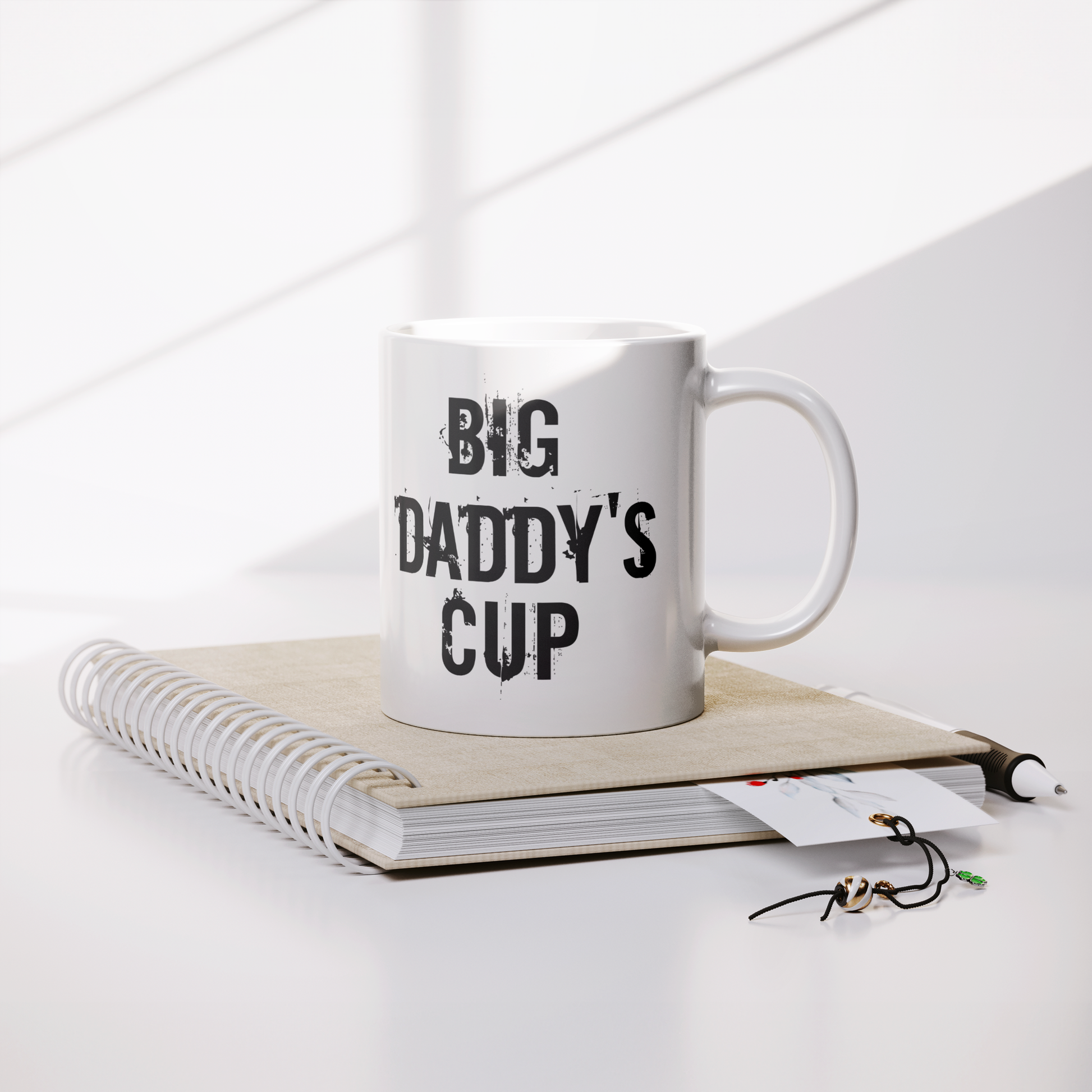 Big_Daddys_Cup_-_White_Ceramic_Mug_for__Lifestyle_Notebook_Mockup.png
