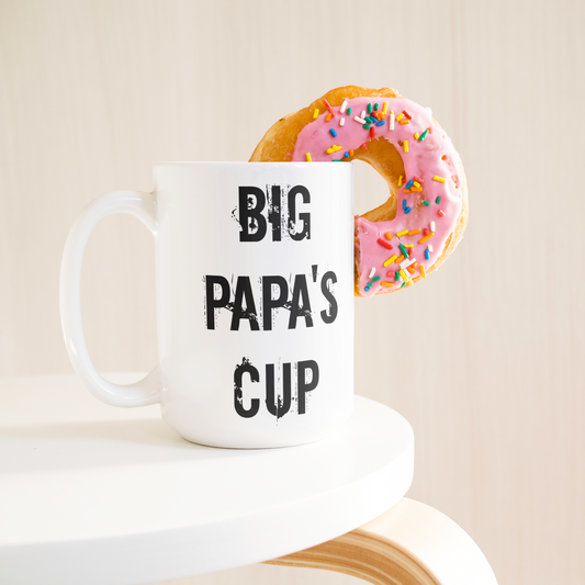 Big_papas_cup_Coffee_Mug_15ozWhiteMugLifetsyleDonutLH_Mockup.png