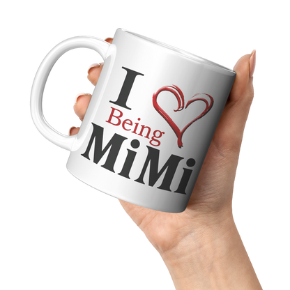 I__Being_Mimi_White_Mug_11oz_White_LH_Model_Mockup.png_15620063
