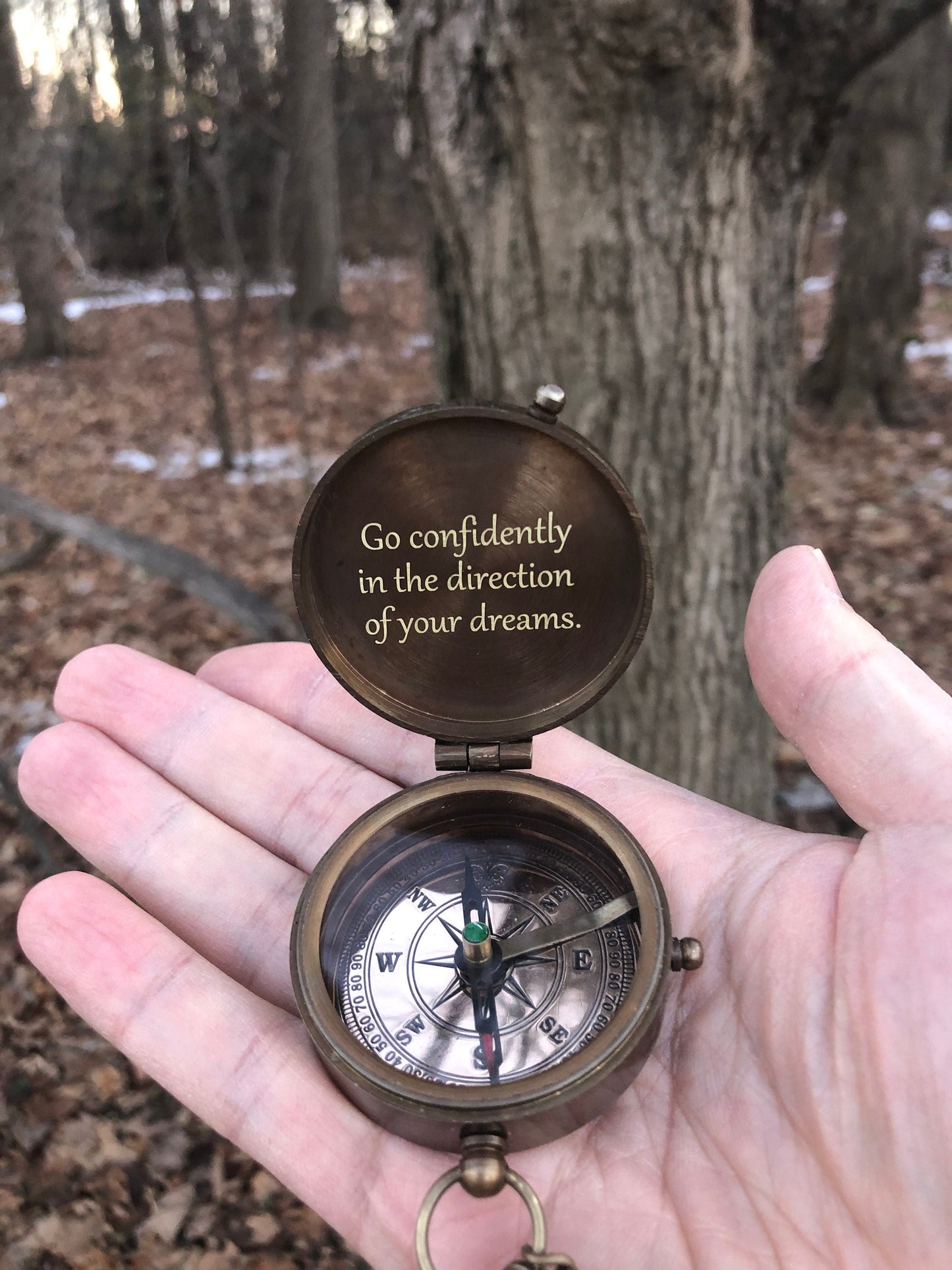 Brass compass with engraved quote on the lid