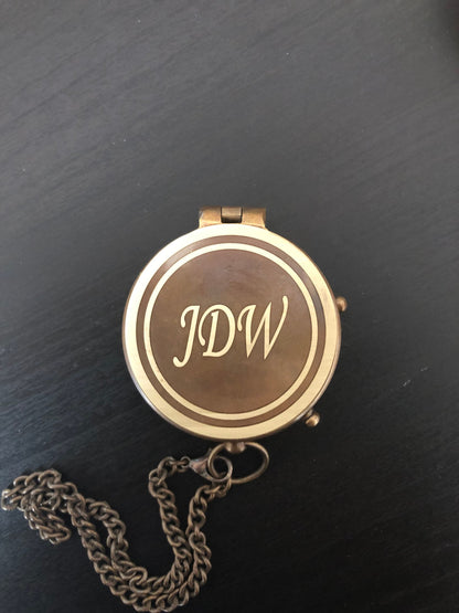 Brass compass with chain, engraved initials on face